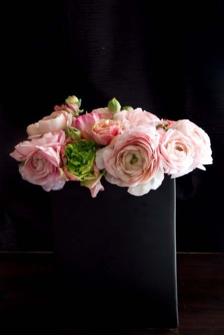 Though the flowers are a soft blush pink the matte black vase and 